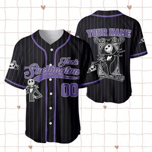 May include: Black baseball jersey with purple pinstripes, featuring the text "Jack Skellington" and the number "00". The jersey has a button-up front and a design of Jack Skellington on the front and back.