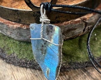 Labradorite with simple wire wrap in sterling silver. On long black leather cord with slip knot closure. Necklace handmade with love