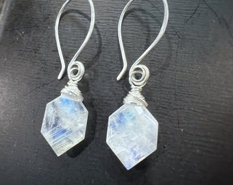 Moonstone wire wrapped in sterling silver on long hand formed and hammered sterling ear wires. Earrings handmade with love