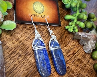 Lapis Lazuli wire wrapped in sterling silver. On hand formed and hammered sterling silver ear wires. Earrings handmade with love