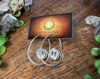 Hand formed and hammered sterling silver hoops with beautifully faceted Quartz beads. Earrings handmade with love