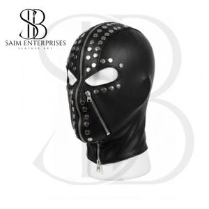 May include: Black leather hood with silver studs and zips. The hood covers the head and neck, featuring eye openings and a zippered mouth area. The product is from Saim Enterprises Leather Art.