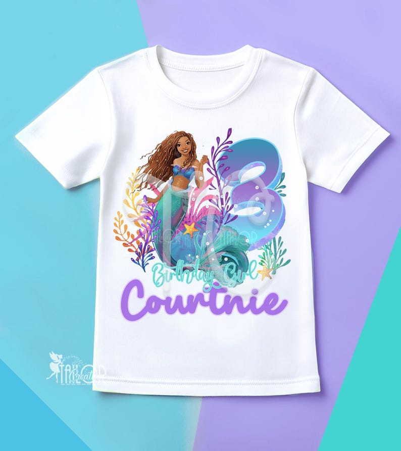 May include: White t-shirt with a mermaid design, the number 3, the name "Courtinie", and the words "Birthday Girl". The mermaid has brown hair and wears a blue top and a teal tail.