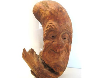 Décoration rustique vintage en bois sculpté représentant un esprit d'arbre et une racine. Art populaire.