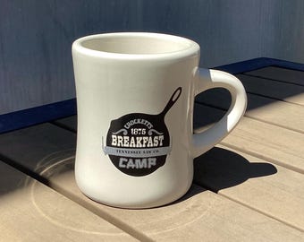 Taza de cerámica del restaurante "Tennessee Saw" de Crocketts, 1875