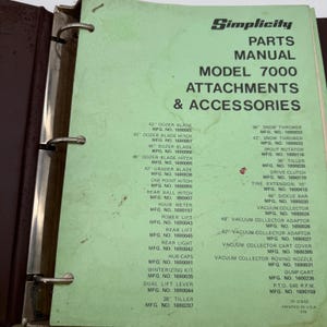 May include: A light green Simplicity parts manual for Model 7000 attachments and accessories, secured in a dark brown three-ring binder. The cover lists various equipment parts, including dozer blades, snow throwers, and tillers with model numbers.
