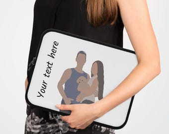 May include: A white laptop sleeve with a black border, featuring a custom illustration of a couple and a dog. The text "Your text here" is printed vertically on the left side of the sleeve. The sleeve is held by a person.