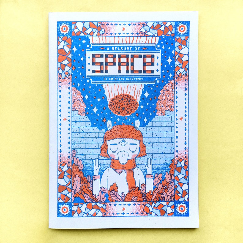 May include: A blue and orange illustrated book cover with the title "A Measure of Space" by Kristina Baczynski. The cover features a cartoon character with a red scarf and a blue background with stars and a brick wall.