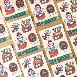 May include: A collection of illustrated stickers with a garden theme. The stickers feature a person gardening, a basket of vegetables, a four-leaf clover, and the text "Unlucky" and "Tuck Me In". The stickers are on a grid-patterned background.