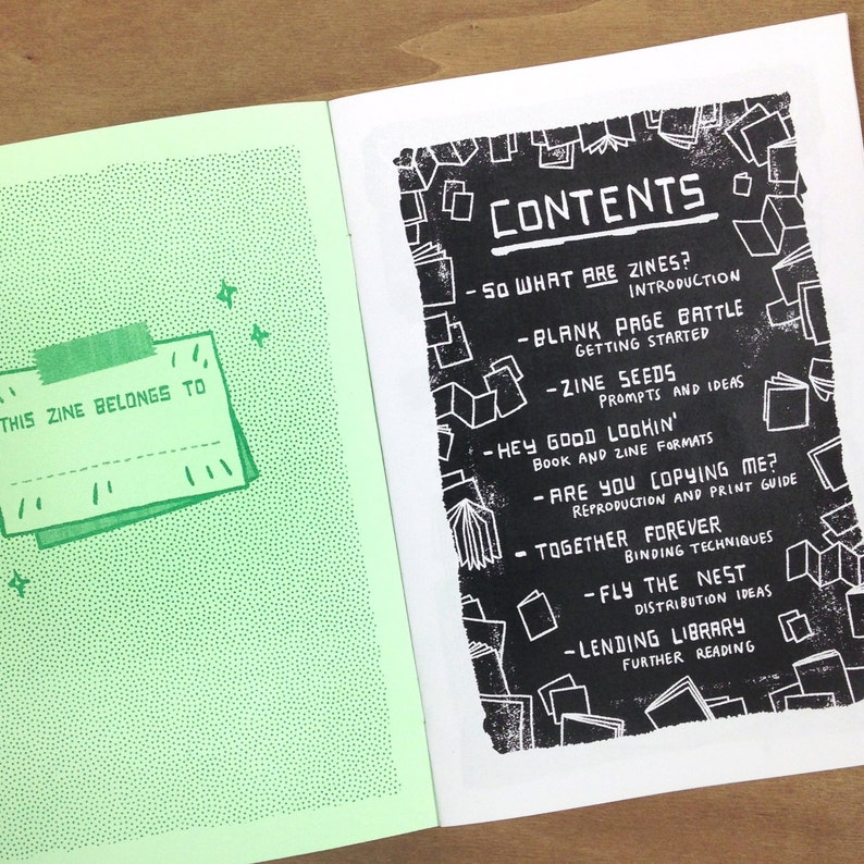 May include: A green and white zine with a title page that says "This zine belongs to" and a table of contents page with the title "Contents" and a list of topics including "So What Are Zines?", "Blank Page Battle", "Zine Seeds", "Hey Good Lookin'", "Are You Copying Me?", "Together Forever", "Fly the Nest", "Lending Library".