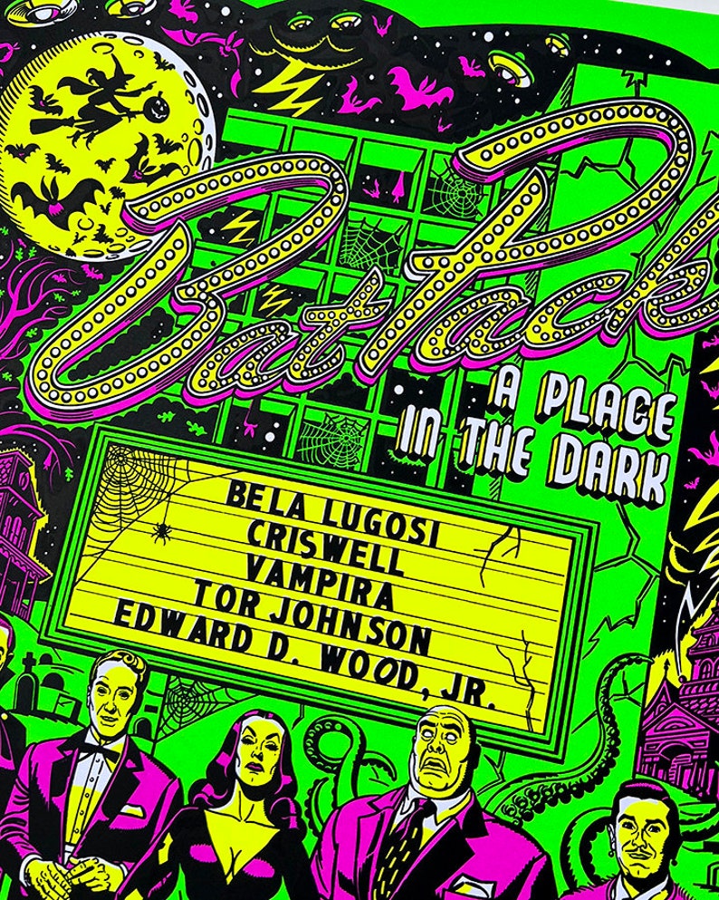 May include: A green and black poster with a neon sign that reads "Attack, A Place in the Dark". The poster features a cast of characters including Bela Lugosi, Criswell, Vampira, Tor Johnson, and Edward D. Wood Jr.