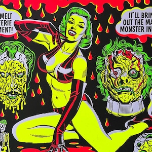 May include: A vintage-style illustration of a woman in a red and black bikini with a green wig, a dripping green-faced monster, and a skeleton. The background is black with red dripping blood. The text "Spook Show" is at the top of the image. The text "It'll bring out the monster in you" is on the right side of the image.