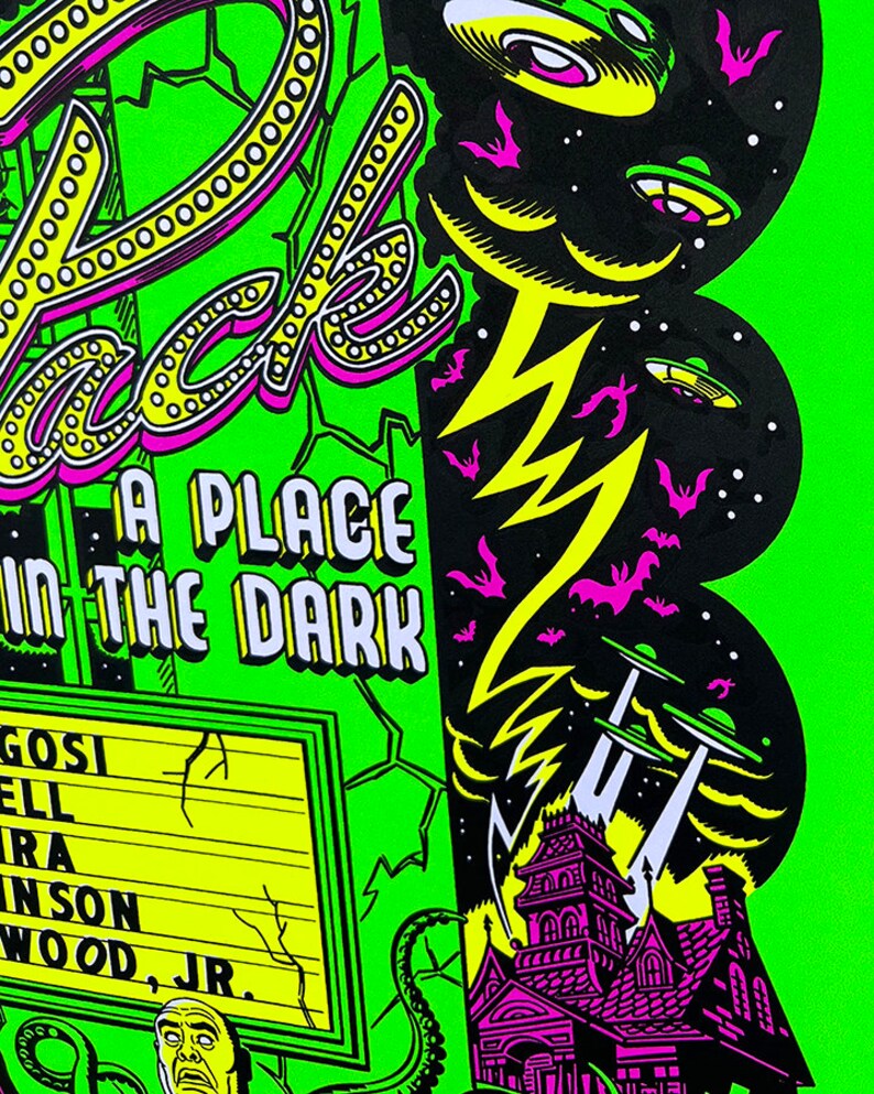 May include: A green and black illustration of a haunted house with a sign that reads "Pack's A Place In The Dark". The sign has a marquee with the names "Gosi, Ell, Ira, Inson, Wood, Jr.". There are flying saucers and bats in the sky.