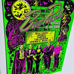 May include: A green and black poster with the title "Bat Pack: A Place in the Dark" featuring a group of actors from classic horror films. The actors include Bela Lugosi, Criswell, Vampira, Tor Johnson, and Edward D. Wood Jr.