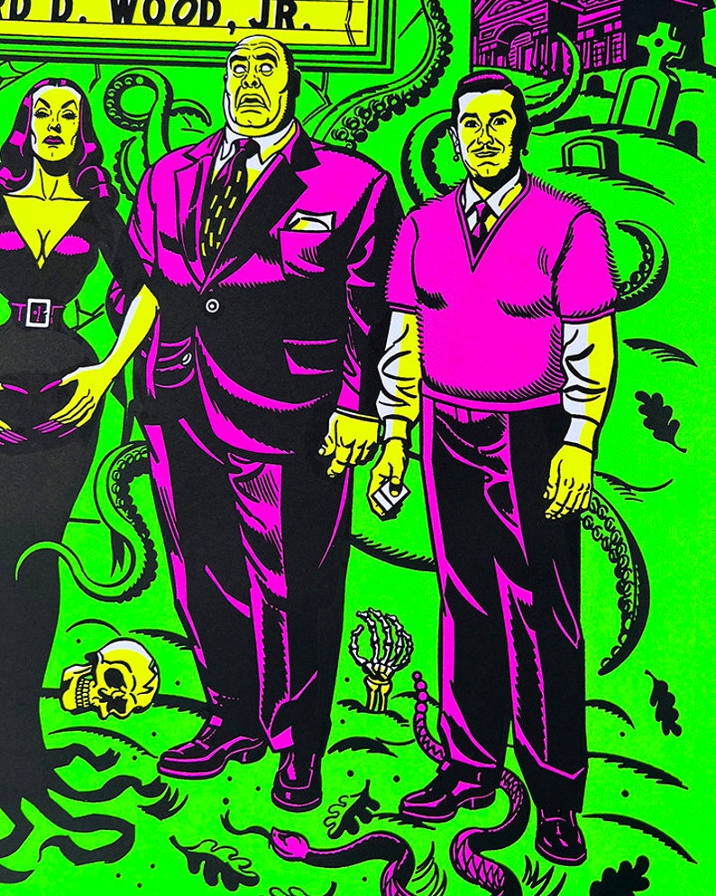 May include: A black and white illustration of three people standing in front of a green background with snakes and skulls. The text "D. WOOD, JR." is visible at the top of the image.