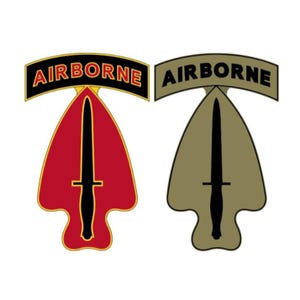 May include: Two Airborne insignia patches. One is red with a black dagger and the word "AIRBORNE" in a black banner. The other is olive green with a black dagger and the word "AIRBORNE" in a gray banner.