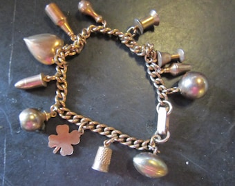 vintage heavy brass charm bracelet thimble heart clover football wine glass bottle spool bullet and more