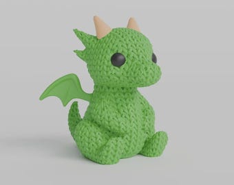 May include: A green knitted dragon figurine with black eyes, small light brown horns, and green wings. The dragon is sitting with its legs tucked in, and the overall design is cute and whimsical.