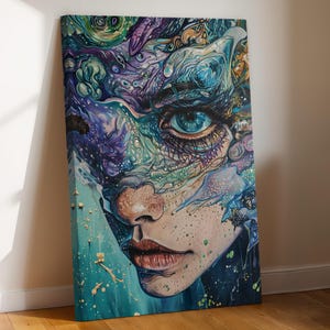 May include: A canvas print featuring a detailed portrait of a person with a striking blue eye. The artwork uses a palette of blues, purples, and greens, with intricate patterns and textures. The person's lips are a deep red, and the skin has freckles.