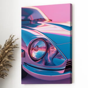 May include: A canvas print featuring a close-up of a vintage car's front end. The car is painted in shades of blue and pink, with a reflective, metallic finish. The headlight is round and detailed, reflecting the surrounding colors.