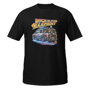 May include: Black t-shirt featuring a graphic of a silver SUV with lightning bolts and the text "BACK IN MY ELEMENT" in yellow and orange. The vehicle has a futuristic design with lights and equipment on top.