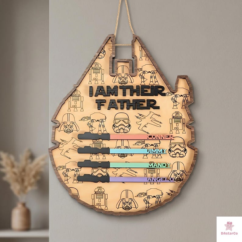 A wooden sign with a Star Wars theme, featuring various characters and the text "I AM THEIR FATHER" in a playful and creative design.