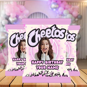 May include: Custom Cheetos chip bags with a pink and white design. The bags feature a photo of a woman and the text "Happy Birthday Your Name". The Cheetos logo is in black and white.