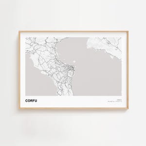 May include: A framed map print of Corfu, Greece, in grayscale. The map features detailed road networks and geographical outlines against a light gray background. The word "CORFU" is printed in black at the bottom left.