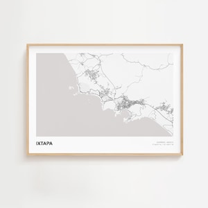 May include: A framed map print of Ixtapa, Mexico, in black and white. The map shows the city's layout with roads and buildings. The text "IXTAPA" is at the bottom left, and "GUERRERO, MEXICO" with coordinates is at the bottom right.