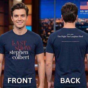 May include: Navy blue t-shirt with the text "The Last Show with Stephen Colbert" in red and white on the front. The back of the shirt has the text "05.21.2026 The Night The Laughter Died".
