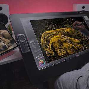 May include: A digital artist is creating a golden illustration of a sleeping dog on a large black drawing tablet. A smaller tablet displays a photo of the dog. The artist is using a stylus to add details to the artwork. The background is a pinkish-red.