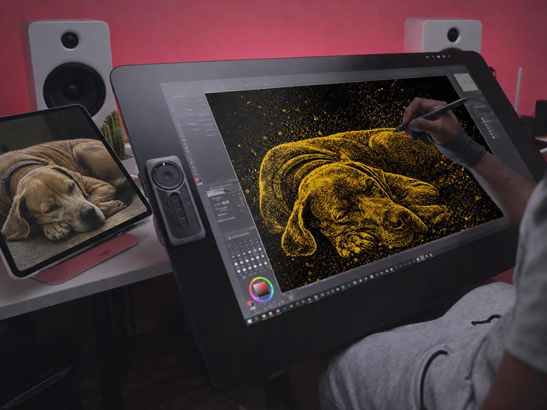 May include: A digital artist is creating a golden illustration of a sleeping dog on a large black drawing tablet. A smaller tablet displays a photo of the dog. The artist is using a stylus to add details to the artwork. The background is a pinkish-red.