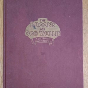 May include: A handmade wooden sign with the word "Welcome" in a playful font. It has a distressed white background and a dark brown frame, suitable for a front door or hallway.