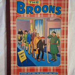 May include: A vintage comic book titled "The Broons" with a red and white tartan cover. The cover illustration shows a queue of people waiting for tickets, with a uniformed man holding a long ticket roll. The text reads "Scotland's Happy Family That Makes Every Family Happy."