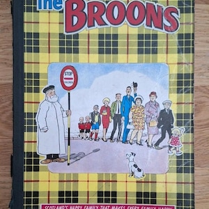 May include: A vintage copy of "The Broons" comic book. The cover has a yellow and black tartan pattern with the title in red and white. A cartoon illustration shows a family and a stop sign. The text at the bottom reads "Scotland's Happy Family That Makes Every Family Happy."