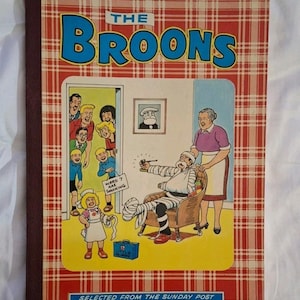 May include: A vintage copy of "The Broons" comic book, featuring a red and white tartan cover. The cover illustration depicts a family scene and a doctor attending to a patient. Text includes "The Broons" and "Selected from the Sunday Post and Earlier Broons Books."