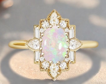 May include: A gold ring featuring an oval opal gemstone surrounded by a halo of small diamonds and baguette-cut stones. The ring has a delicate, vintage-inspired design with a slender band. The opal displays a play of color, with flashes of pink, green, and blue.