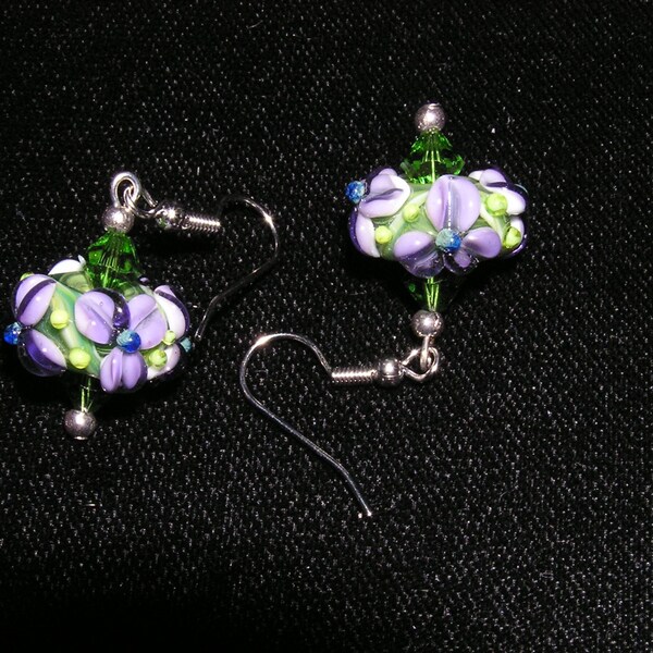 Tropical lampwork green bead with purple pansies French wire earrings. FREE US SHIPPING.