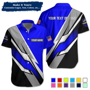 May include: A short-sleeved shirt with a blue, black, and grey design. The shirt has the text "YOUR TEXT OR LOGO" on the back and "YOUR NAME" on the front. The design includes a racing flag and an American flag.