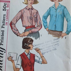 May include: A vintage sewing pattern featuring three different styles of blouses. The pattern is for a size 12 bust and is printed on a white background. The pattern includes instructions for making a striped blouse, a solid blue blouse, and a vest.