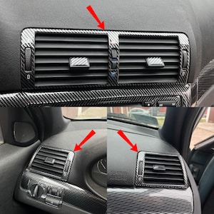 May include: Carbon fibre style interior trim kit for a car dashboard. The kit includes trim pieces for the air vents and surrounding areas. The trim has a black and grey woven pattern, adding a sporty and modern look to the vehicle's interior.