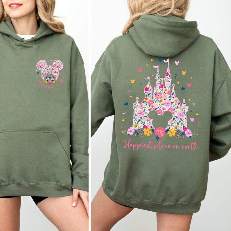 May include: Olive green hoodie with a front pocket and a hood. The front features a floral Mickey Mouse head design. The back displays a floral castle design with the text "Happiest place on earth".