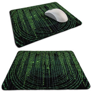 May include: Black mouse mat featuring a green binary code design. A white computer mouse sits on the mat. The design shows concentric circles of green numbers and symbols against a black background.
