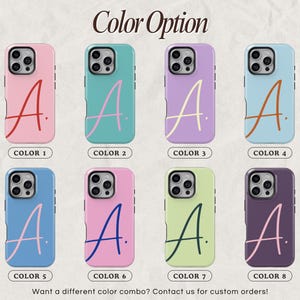 May include: Eight phone cases in various colors, each featuring a stylized letter "A". The cases are in shades of pink, teal, lavender, blue, and green, with the letter in contrasting colors. Text at the top reads "Color Option".