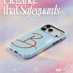 May include: A light blue phone case with an orange letter "B" design. The case has a glossy finish and features the text "Elegance that Safeguards". The case is scratch-resistant and has high-quality printing with precise port cutouts.