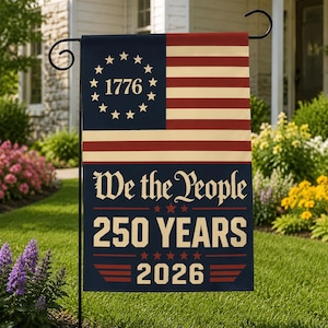 May include: A patriotic garden flag featuring a design reminiscent of the American flag. The flag has a blue field with stars and the year "1776", and red and white stripes. The text "We the People 250 YEARS 2026" is displayed.