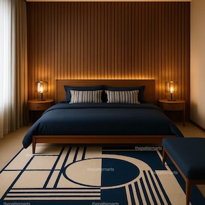 Modern navy blue and cream geometric area rug placed in a contemporary bedroom interior