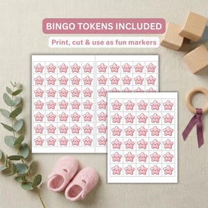 May include: A printable sheet of bingo tokens featuring rows of small pink stars with smiling faces. The text BINGO TOKENS INCLUDED and Print, cut & use as fun markers is visible at the top of the page. The sheet is displayed with baby shoes.