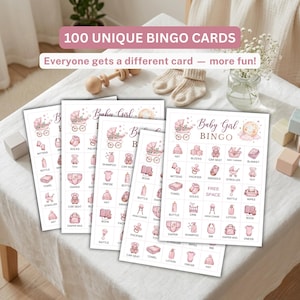 May include: A set of baby shower bingo cards featuring pink illustrations of baby items like strollers, bottles, and onesies. Each card includes the text Baby Girl BINGO and a grid of icons with labels. The cards are displayed on a white surface.
