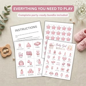 May include: A baby shower bingo game set featuring printed instruction sheets and bingo cards with pink illustrations of baby items like a high chair, hat, towel, crib, book, toy, diaper bag, mittens, shampoo, lotion, blocks, and rattle.